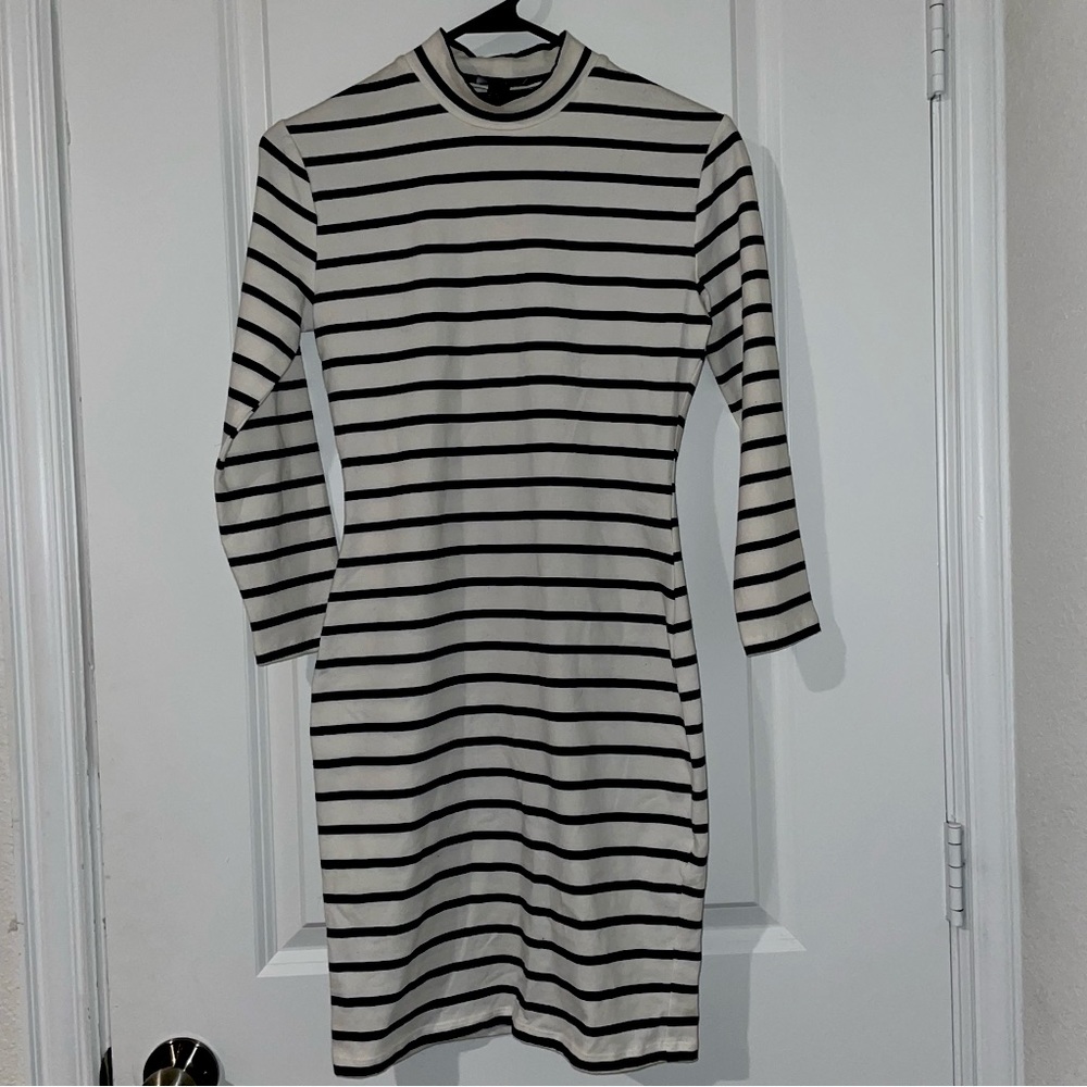 Brand New black and white striped, high necked, long sleeved body con dress
